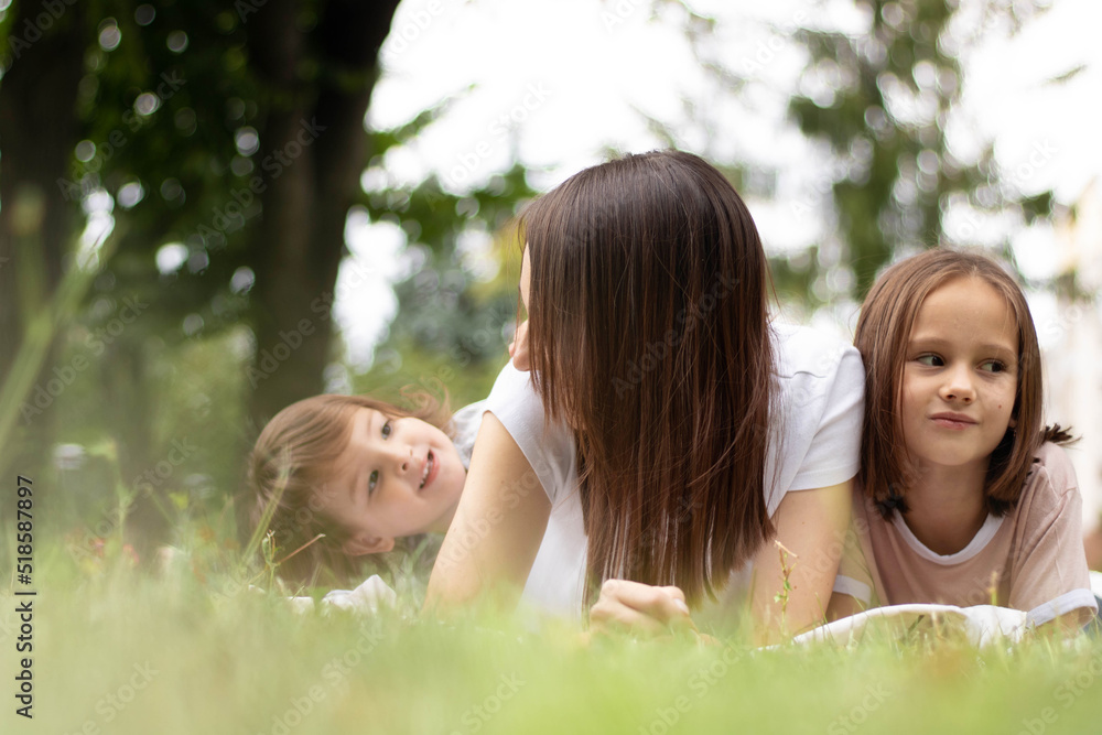 Offended sisters sit ignoring, turning away from each other with crossed arms, bad relationship between younger sister, children conflict Offended sisters sit ignoring, turning away from each other with crossed arms, bad relationship between younger sister, children conflict