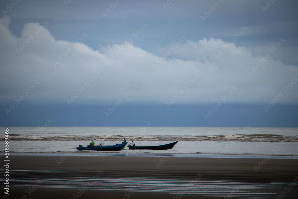 boats on the beach on a grey day boats on the beach on a grey day
