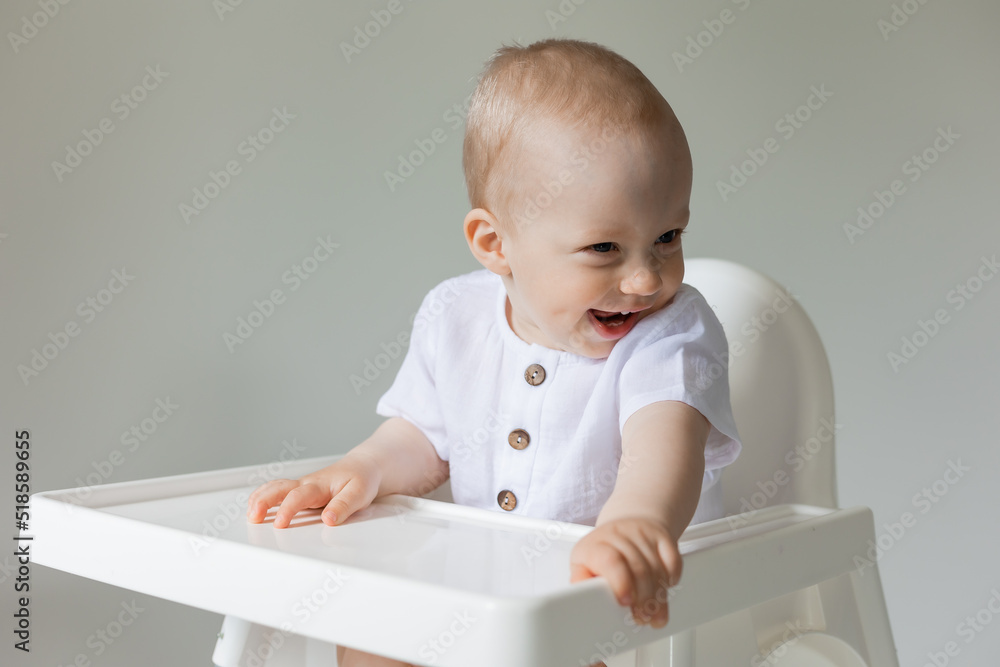 cheerful little boy in high chair, health, space for text, banner, card cheerful little boy in high chair, health, space for text, banner, card