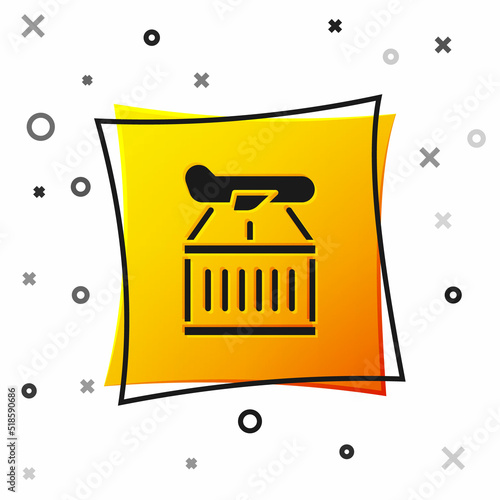 Black Plane icon isolated on white background. Delivery, transportation. Cargo delivery by air. Airplane with parcels, boxes. Yellow square button. Vector