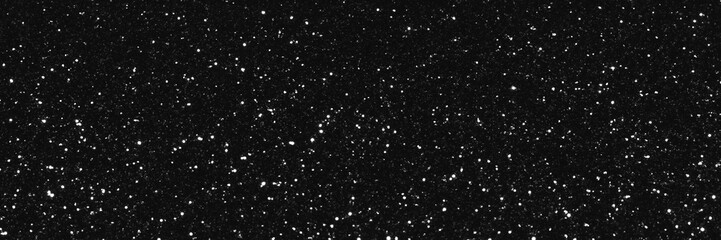 Gray black sparkling glitter background, christmas abstract shiny texture. Holiday bokeh lights. Snowy sparkle stars header. Wide screen wallpaper. Panoramic web banner with copy space for design
