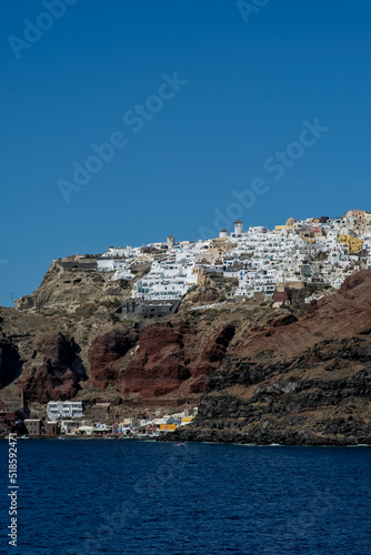 View of the picturesque village of Oia and the the famous Ammoudi harbour in Santorini Greece
