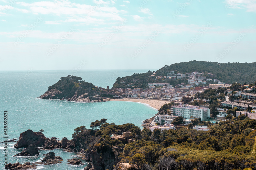 Coastal landscape with rocky hills and trees. Shore on Costa Brava in Spain