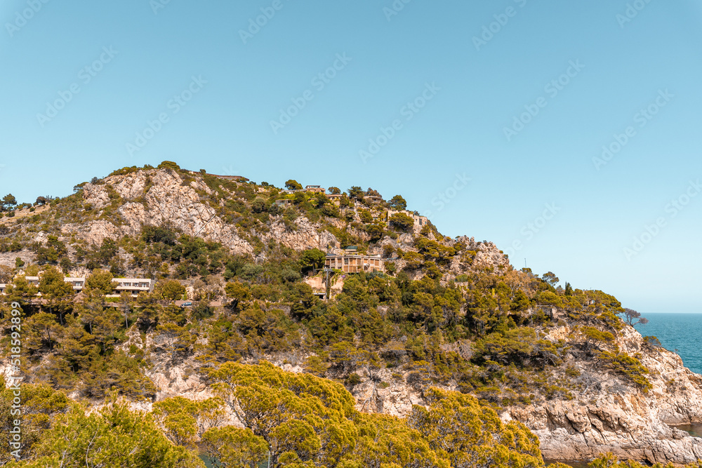 Coastal landscape with rocky hills and trees. Shore on Costa Brava in Spain Coastal landscape with rocky hills and trees. Shore on Costa Brava in Spain