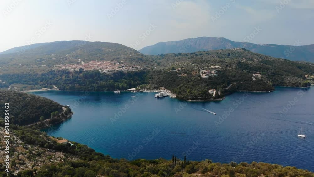Drone shot flying above a hill and road at Meganisi island in Greece Drone shot flying above a hill and road at Meganisi island in Greece