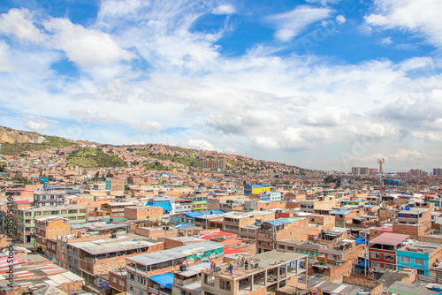 Tableau sur toile view from the top of the mountain, colorful houses, Ciudad Bolivar, Bogotá Colom