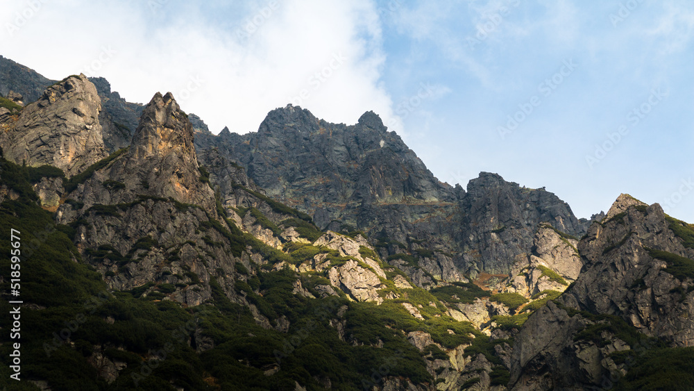 View at the mountains rig in Tatra National Park in Poland. Amazing sun shining through the clouds.