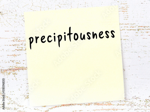 Tableau sur toile Yellow sticky note on wooden wall with handwritten word precipitousness