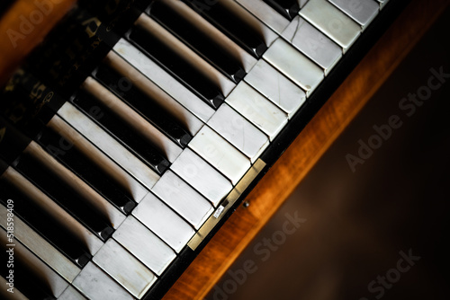antique piano with black and white keys