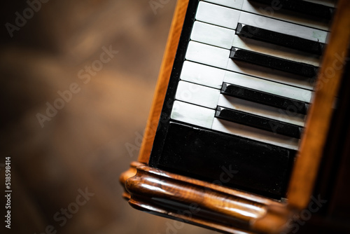 antique piano with black and white keys