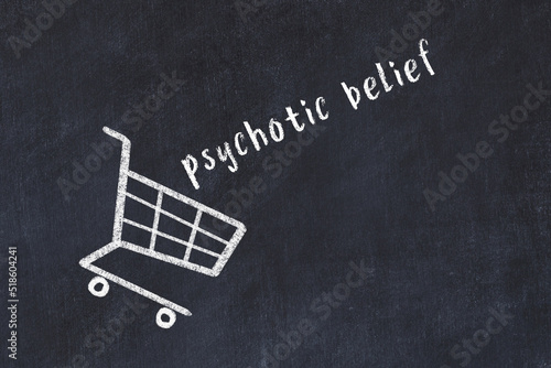 Fotografija Chalk drawing of shopping cart and word psychotic belief on black chalboard