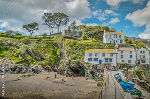 Shot of houses on the hill with cloudy skies near Polperro beach photo