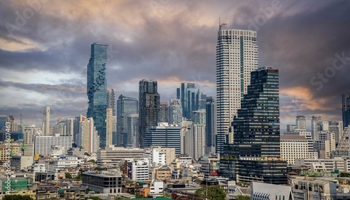Photography Aerial view of the skyscrapers of Bangkok, Thailand, at sunset