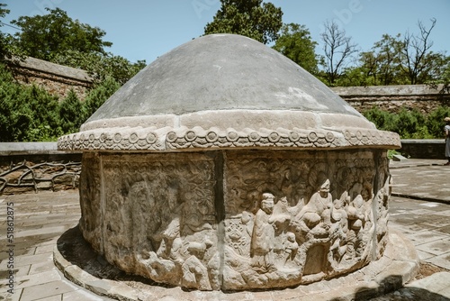 Closeup of TianYi Tomb (Eunuch Tomb) with carving scupltures in Beijing, China photo