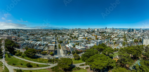 Pacific Heights, Nob Hill neighborhoods viewed from Alamo square in San Francisco aerial view with blue sky photo