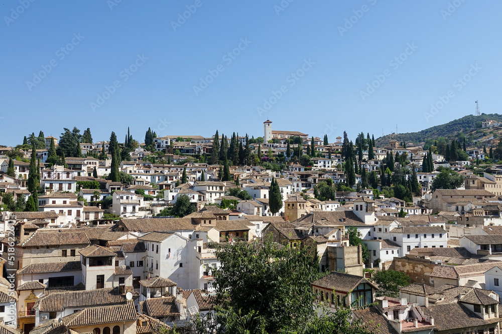 View of the Moorish quarter of the Albaicin (Granada, Spain) from the viewpoint of La Churra on a sunny summer morning