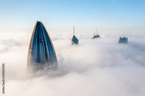 Kuwait city buildings at fog time photo