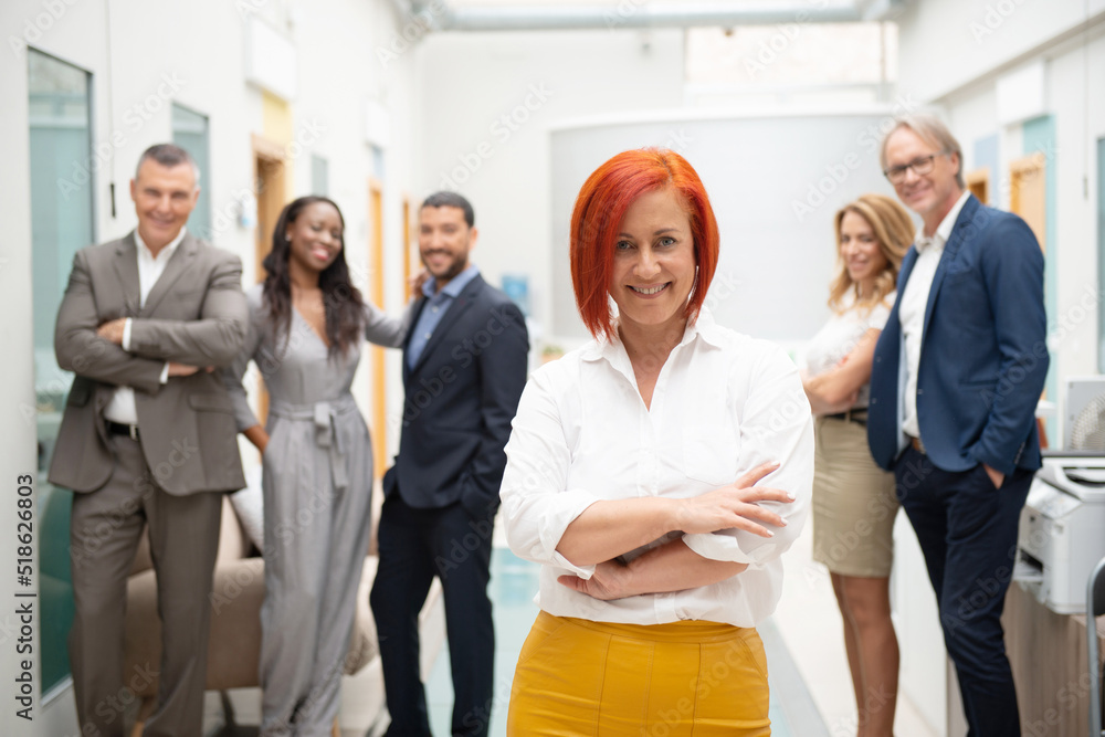 Business team of men and women in an office with her leader Business team of men and women in an office with her leader