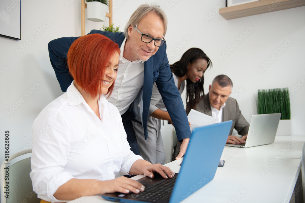 Business team of men and women in an office