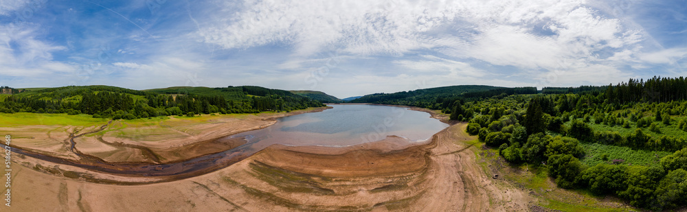 Panoramic aerial view of extremely low water levels at a reservoir during a heatwave Panoramic aerial view of extremely low water levels at a reservoir during a heatwave