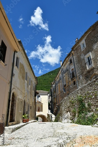 Narrow street surrounded by stony buildings in village San Donato Val di Comino photo