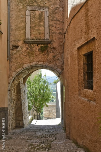 Narrow street surrounded by stony buildings in village San Donato Val di Comino photo