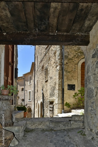 Narrow street surrounded by stony buildings in village San Donato Val di Comino photo