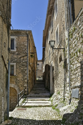 Narrow street in San Donato Val di Comino village near Rome on a sunny day, Italy photo