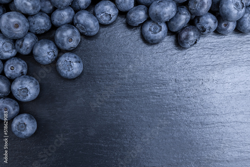 Fresh blueberries summer fruits for a healthy diet on stone background