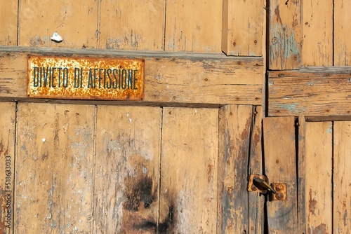Closeup shot of an old wooden door in Schilpario, Italy photo