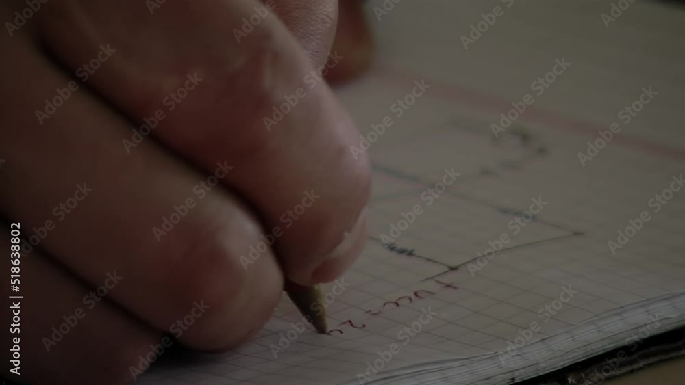 Inmate Drawing an Electrical Diagram on His Notebook during An Education Class for Prisoners in an Argentine Jail. Close Up. Inmate Drawing an Electrical Diagram on His Notebook during An Education Class for Prisoners in an Argentine Jail. Close Up.