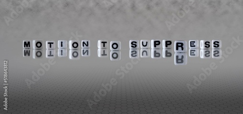 motion to suppress word or concept represented by black and white letter cubes on a grey horizon background stretching to infinity photo