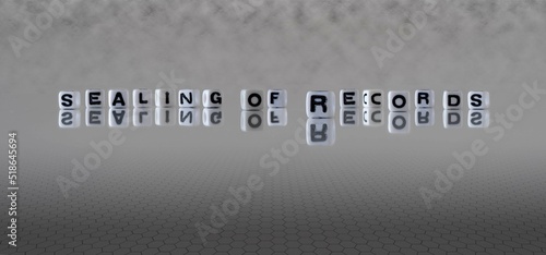фотографія sealing of records word or concept represented by black and white letter cubes o