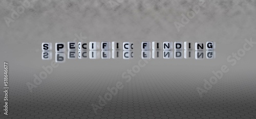 specific finding word or concept represented by black and white letter cubes on a grey horizon background stretching to infinity