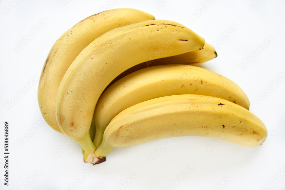 Ripe yellow banana on a white background. A bunch of fresh bananas. Sweet bananas for breakfast.