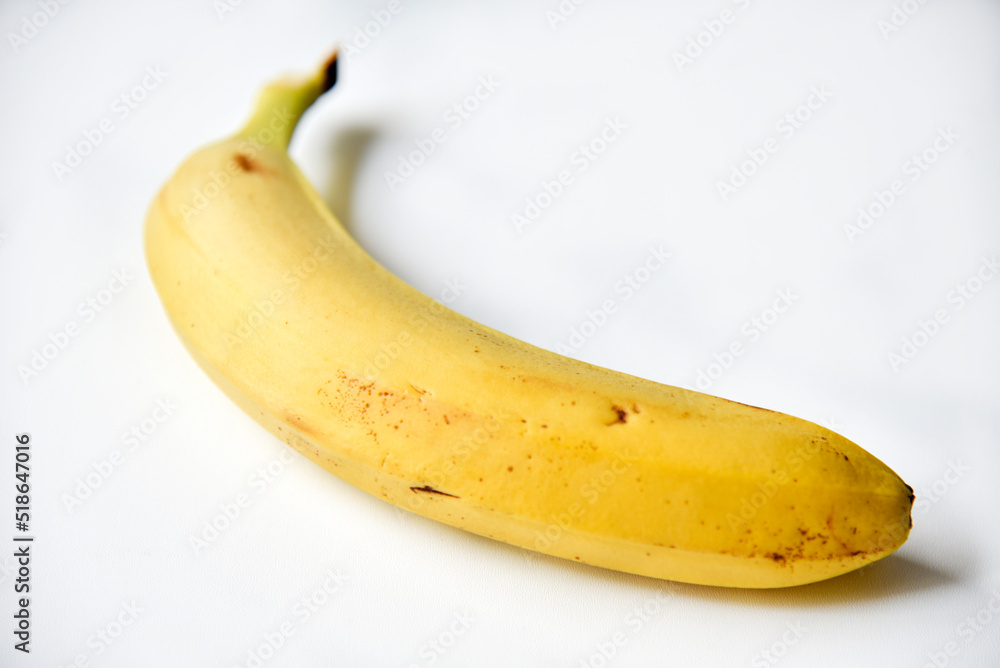 Ripe yellow banana on a white background. A bunch of fresh bananas. Sweet bananas for breakfast. Ripe yellow banana on a white background. A bunch of fresh bananas. Sweet bananas for breakfast.