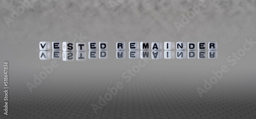 vested remainder word or concept represented by black and white letter cubes on a grey horizon background stretching to infinity