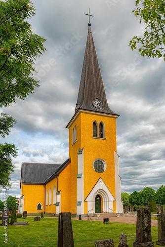 Vertical shot of the Broby Swedish Parish Church in Scania, Sweden photo