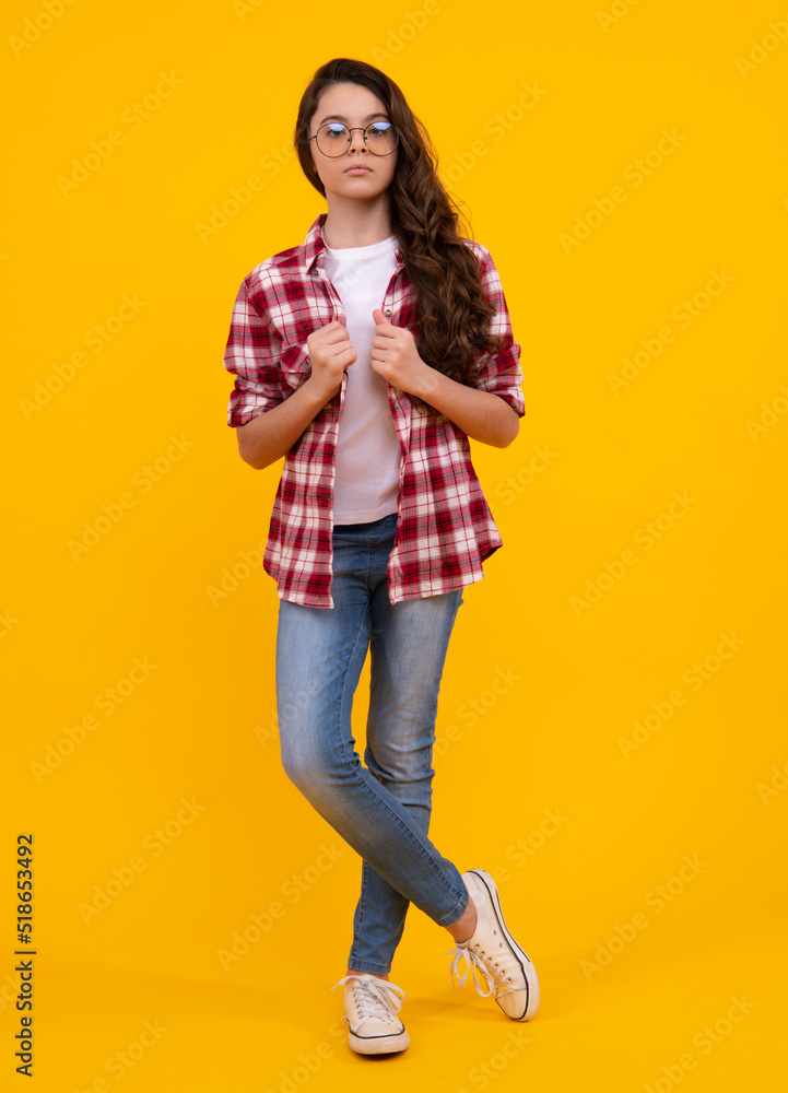 Elegant fashion teenager child girl posing in studio. Trends kids clothes. Elegant fashion teenager child girl posing in studio. Trends kids clothes.