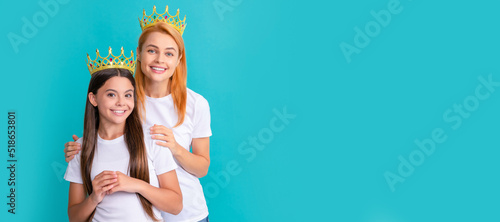 Mother and daughter child banner, copy space, isolated background. Make sure youre the prom queen. Beauty queen and princess. Happy mother and daughter child. © Olena