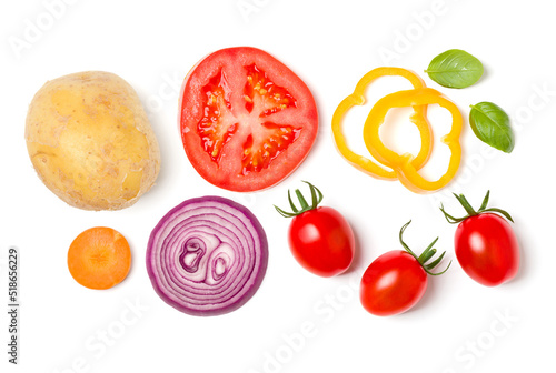 Fototapeta Naklejka Na Ścianę i Meble -  Creative layout made of various vegetables and salad leaves. Flat lay, top view. Food concept. Vegetables isolated on white background. Food ingredient pattern.