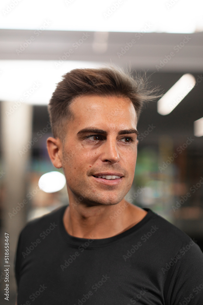 Fototapeta premium Portrait of an expert personal trainer and nutritionist, at the local sports and fitness center, during a training session