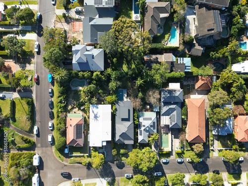 Fototapeta Aerial drone view of a street, houses, and parked cars in the suburbs of Sydney