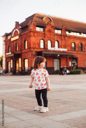 little girl walking and playing on the street in summer © Елена Вырыпаева