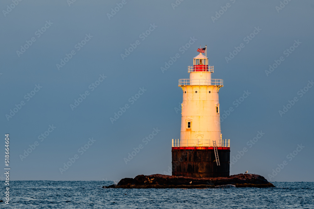 Early morning image of the Sakonnet Point Light (West Island Light) between Little Compton and Tiverton Rhode Island, at Sakonnet River and Atlantic Ocean. 