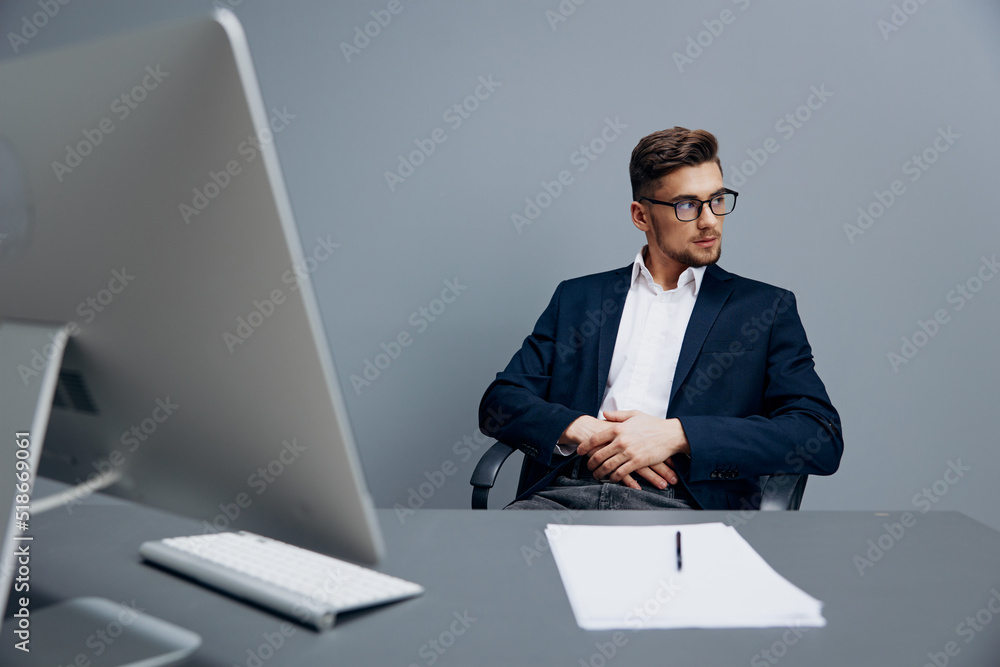 businessmen wearing glasses works in front of a computer office businessmen wearing glasses works in front of a computer office