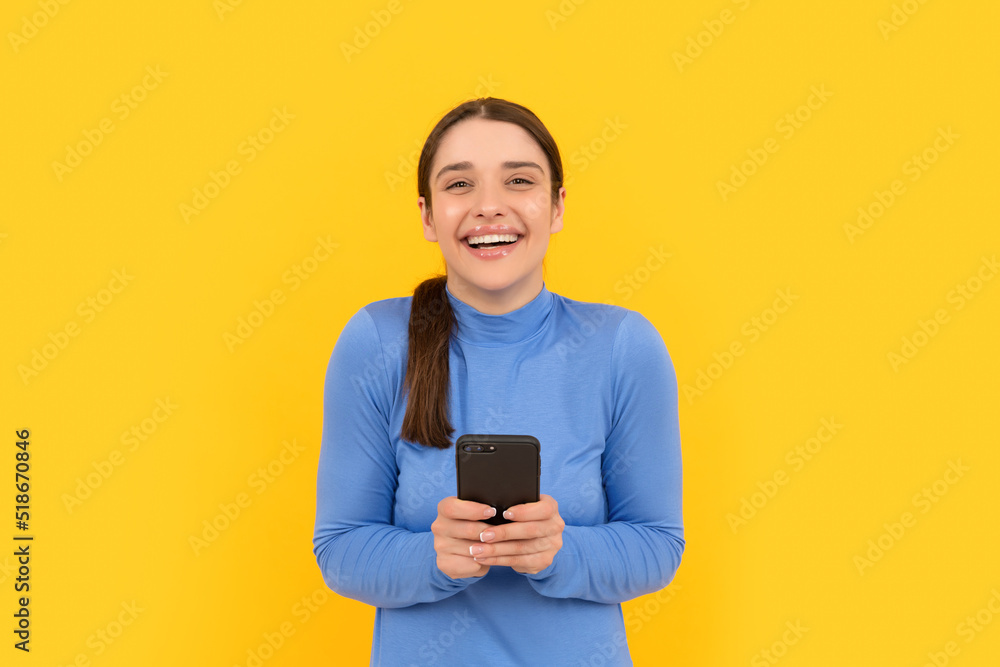 happy lady laughing at text message on smartphone, blogging happy lady laughing at text message on smartphone, blogging