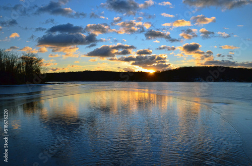 Fototapeta Naklejka Na Ścianę i Meble -  Sunrise over a river with reflection