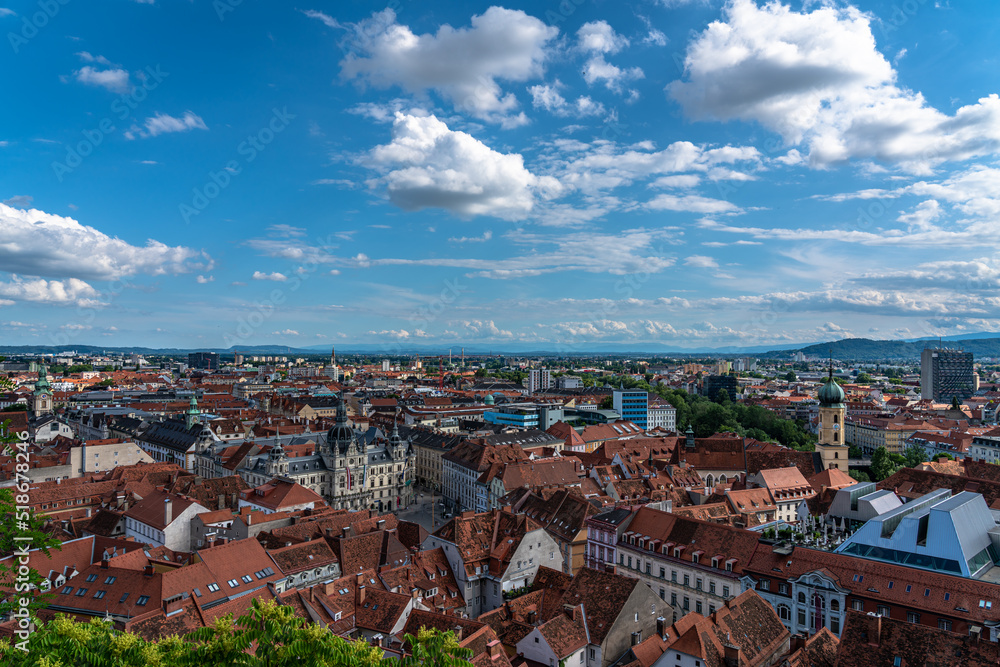 Aerial panorama view of Graz city old town from Castle Hill (Schlossberg) with city hall, main square and Franciscan Church on sunny summer day,  with blue sky cloud, Graz, Styria, Austria