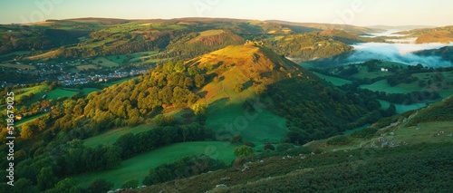Panoramic view of the Castell Dinas Bran, Llangollen in the Welsh valley at dawn photo